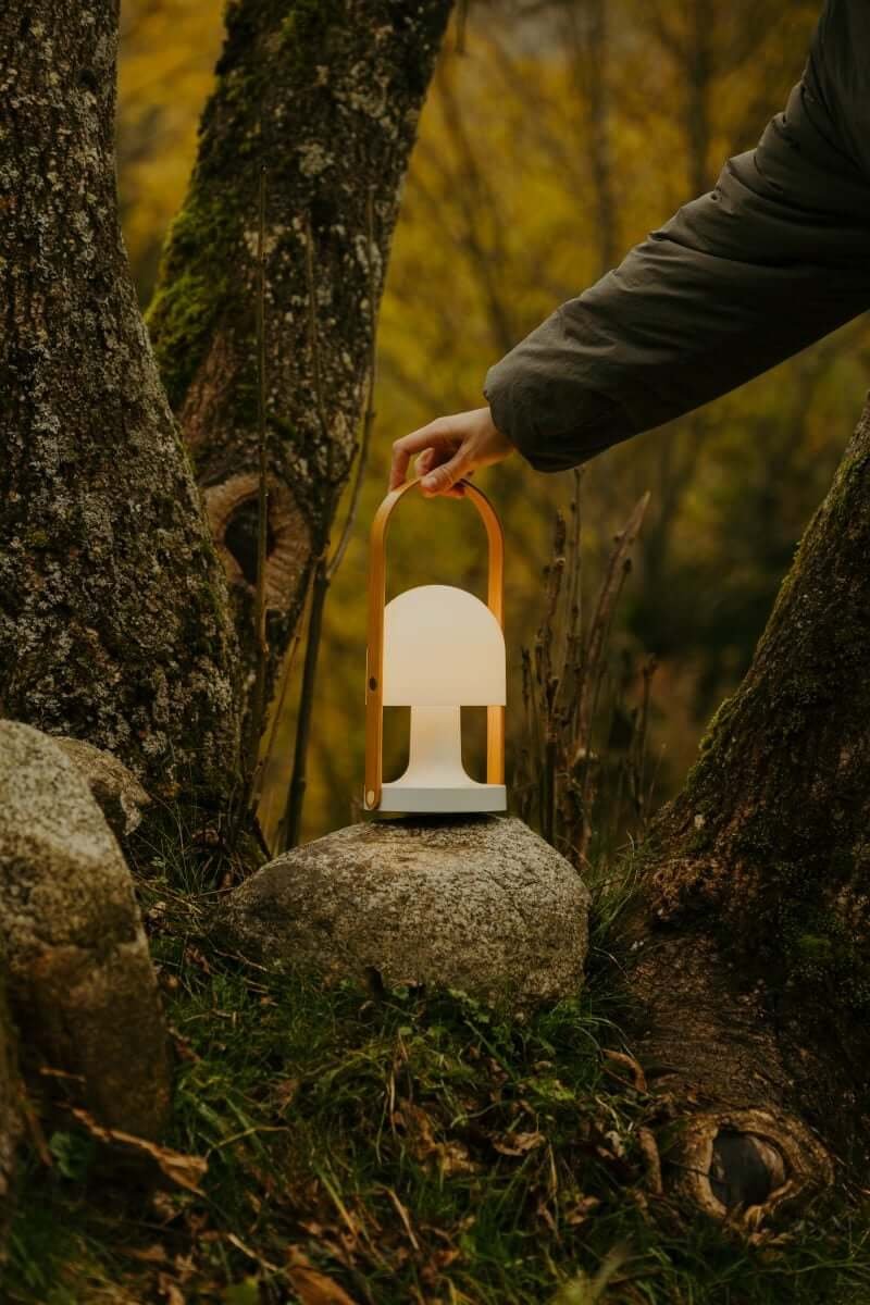 Marset FollowMe portable lamp with oak handle for outdoor use. 